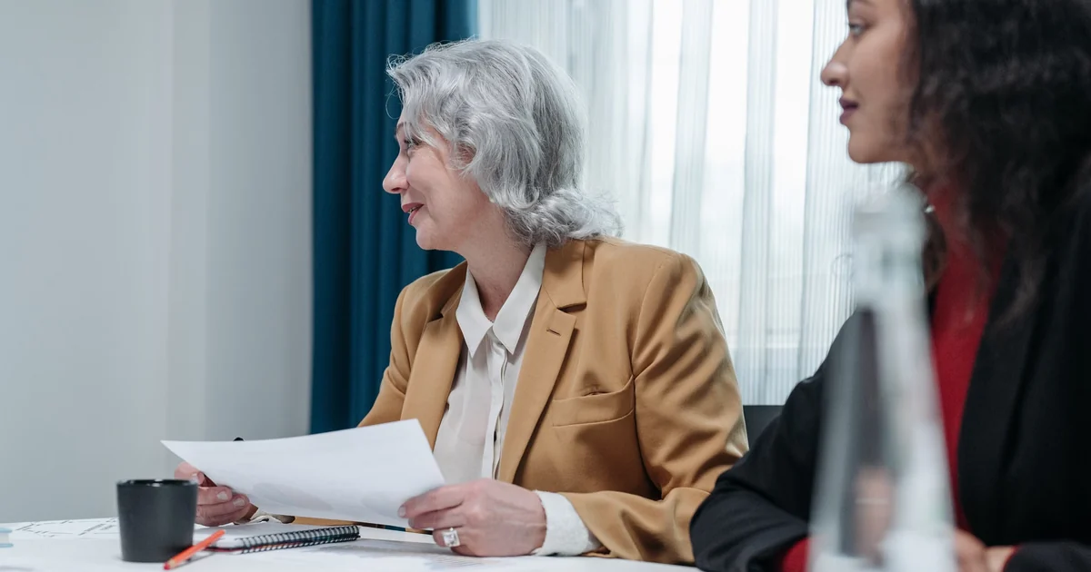 Senior finance executives discussing financial markets and investment instruments