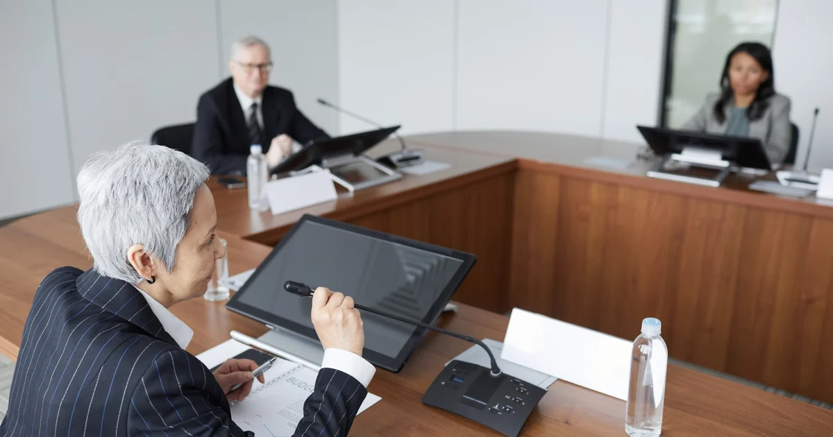 Senior treasury executives reviewing public-sector cash operations